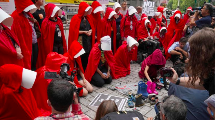 A "Handmaid's Tale"-themed protest was held outside the Alexander Hamilton Customs House in Manhattan on Tuesday. Photo Credit: AFP / Getty Images / Timothy A. Clary