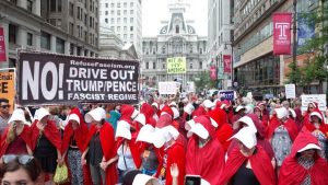 Philadelphia: Mike Pence confronted by 100 women dressed as Handmaids