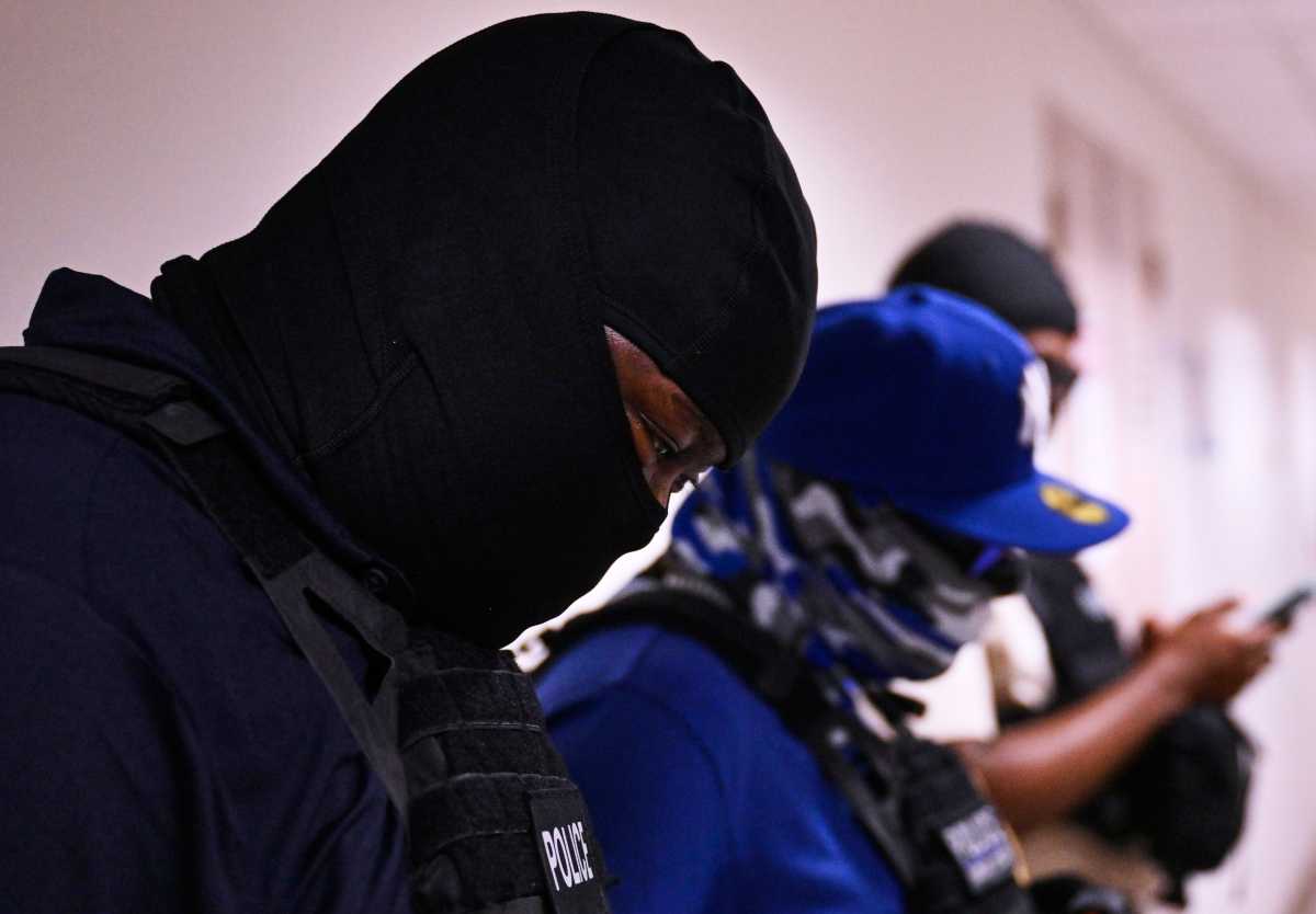 ICE in Courts: Reverend joins protest after congregant detained inside Federal Plaza 1 ICE agents wearing masks line the halls of the 12th floor at 26 Federal Plaza in Manhattan on Friday. The agents remained stationed outside immigration courtrooms, where multiple individuals were detained following their hearings